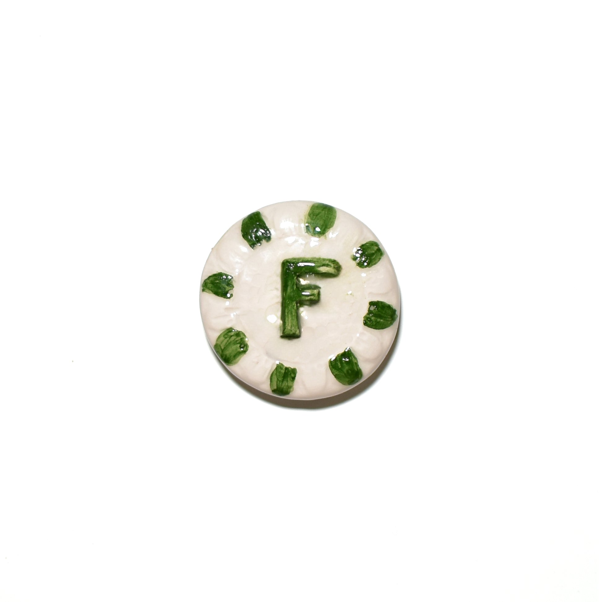 "CLA 3 Cristallina Trasparente Lucida Apiombica prodotto ceramico di alta qualità, perfetto per artisti e professionisti, mostra un disco bianco con decorazioni verdi e la lettera 'F' al centro, Smalti, Colori e Cristalline, Cristalline Lucide AP VLA, Colori Apiombici, Cristallina Neutra, AVADA - Best Sellers, Collezione Ditta Fauci, AVADA Email Marketing - Best Sellers, AVADA Email Marketing - Newest Products"