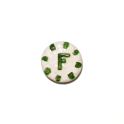 "CLA 3 Cristallina Trasparente Lucida Apiombica prodotto ceramico di alta qualità, perfetto per artisti e professionisti, mostra un disco bianco con decorazioni verdi e la lettera 'F' al centro, Smalti, Colori e Cristalline, Cristalline Lucide AP VLA, Colori Apiombici, Cristallina Neutra, AVADA - Best Sellers, Collezione Ditta Fauci, AVADA Email Marketing - Best Sellers, AVADA Email Marketing - Newest Products"