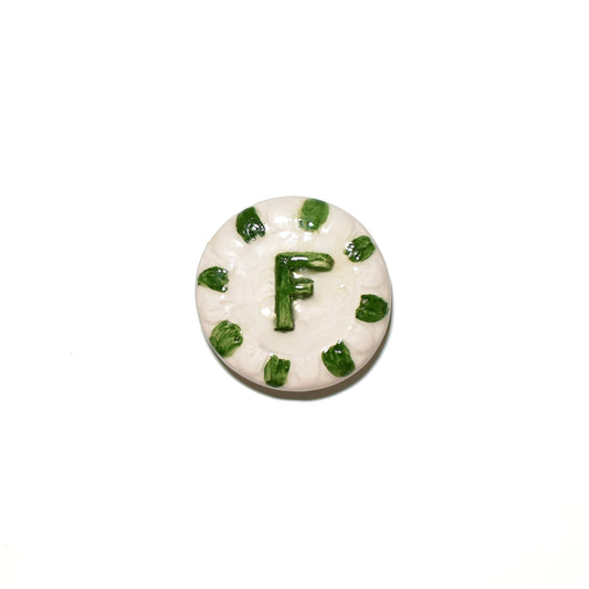"CLA 3 Cristallina Trasparente Lucida Apiombica prodotto ceramico di alta qualità, perfetto per artisti e professionisti, mostra un disco bianco con decorazioni verdi e la lettera 'F' al centro, Smalti, Colori e Cristalline, Cristalline Lucide AP VLA, Colori Apiombici, Cristallina Neutra, AVADA - Best Sellers, Collezione Ditta Fauci, AVADA Email Marketing - Best Sellers, AVADA Email Marketing - Newest Products"